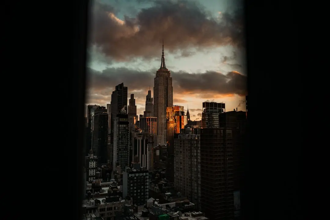 The New York skyline at dusk, seen through a dark window frame, a nod to the US households TvNado streams to